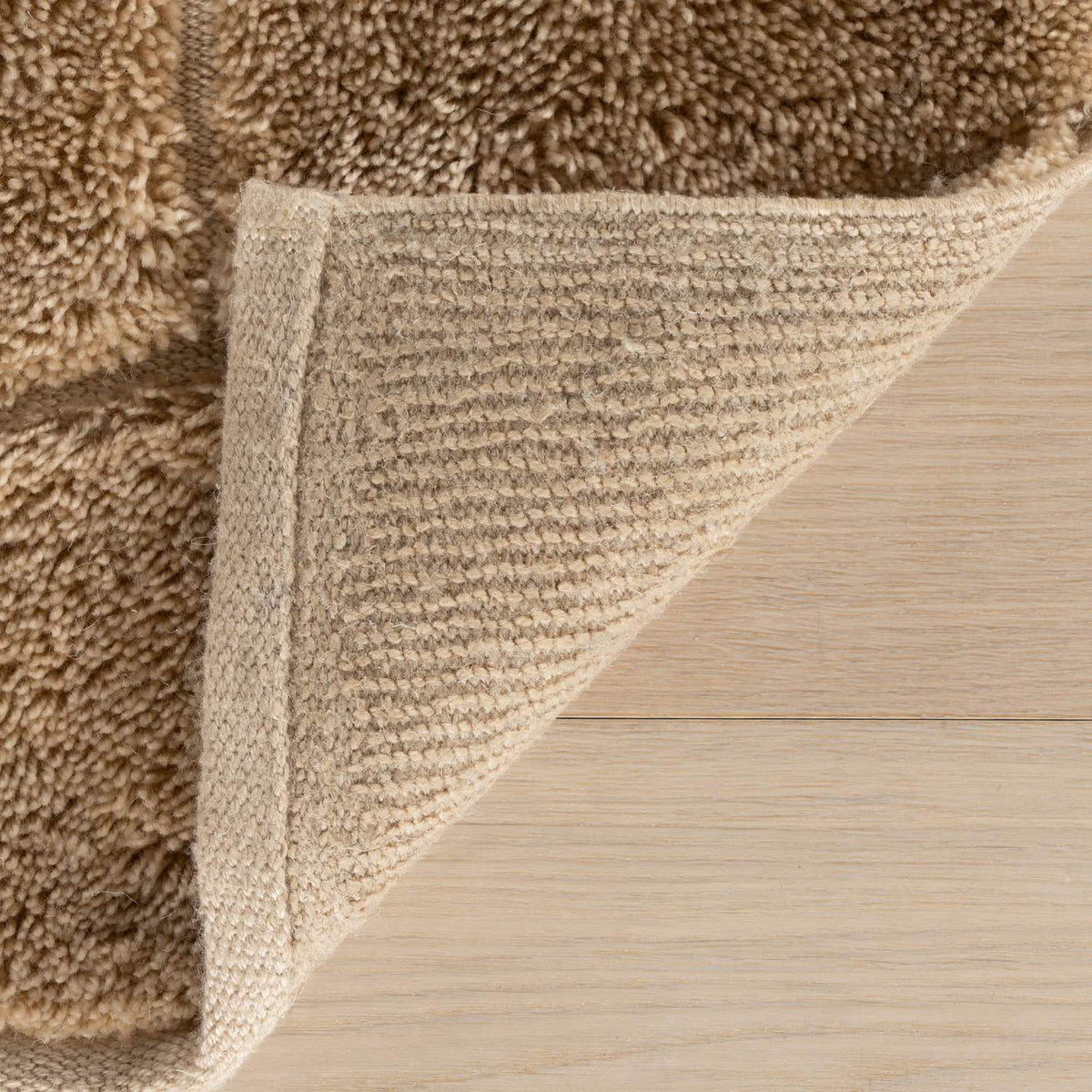 dash albert brela da2526 brown hand tufted recycled pet rug